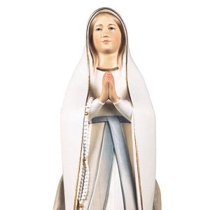 Stylized Madonna of Lourdes statue, wooden sculpture from Val Gardena. The statue is carved in maple wood and hand painted