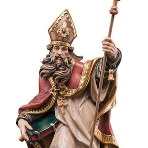 statue of saint christian, wooden sculpture from Val Gardena. The statue is carved in maple wood and hand painted