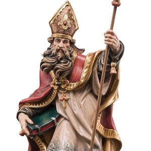 statue of saint elmaro, wooden sculpture from Val Gardena. The statue is carved in maple wood and hand painted