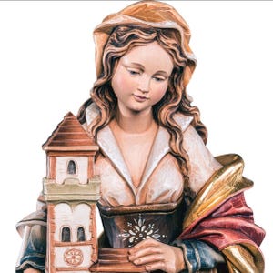 statue of saint barbara, wooden sculpture from Val Gardena. The statue is carved in maple wood and hand painted