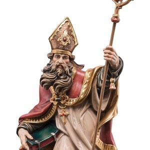 statue of saint eriberto, wooden sculpture from Val Gardena. The statue is carved in maple wood and hand painted