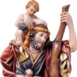 statue of saint christopher, wooden sculpture from Val Gardena. The statue is carved in maple wood and hand painted