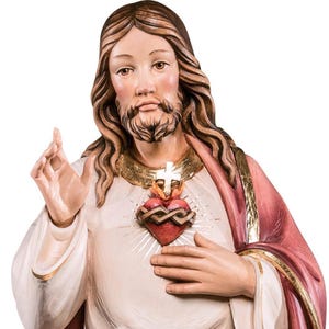 statue of jesus sacred heart, wooden sculpture from Val Gardena. The statue is carved in maple wood and hand painted