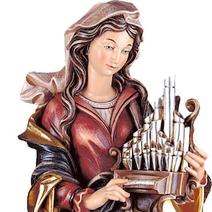statue of saint cecilia, wooden sculpture from Val Gardena. The statue is carved in maple wood and hand painted