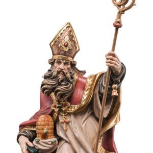 statue of saint ambrogio, wooden sculpture from Val Gardena. The statue is carved in maple wood and hand painted