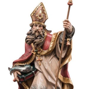 statue of saint ulrich, wooden sculpture from Val Gardena. The statue is carved in maple wood and painted by hand