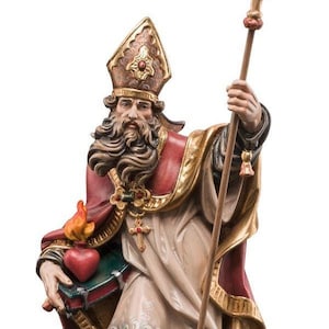 statue of saint francis, wooden sculpture from Val Gardena. The statue is carved in maple wood and hand painted