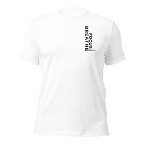 May include: White t-shirt featuring the words "FOCUS, BREATHE, EXECUTE" printed vertically in black. The shirt has a crew neck and short sleeves. The text is positioned on the left side of the shirt.