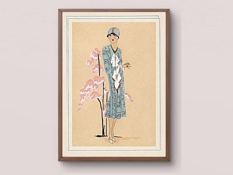1920s Art Deco fashion illustration from Tres Parisien magazine showing a stylish woman in powder blue dress with white tie collar and matching cloche hat, standing beside pink cherry blossoms. Digital wall art from French vintage fashion publication.