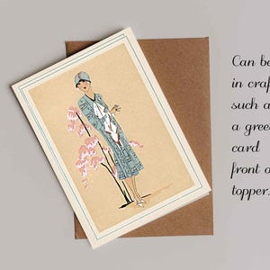 1920s Art Deco fashion illustration from Tres Parisien magazine showing a stylish woman in powder blue dress with white tie collar and matching cloche hat, standing beside pink cherry blossoms. Digital wall art from French vintage fashion publication.