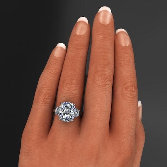 Cushion cut with half sale moon side stones