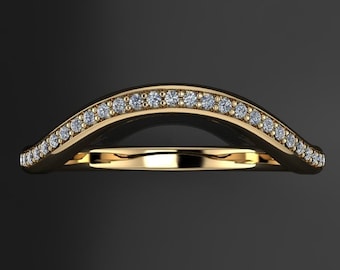 May include: A gold wedding band with a curved design and a row of small diamonds.