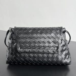 May include: A black woven leather clutch with a flap closure. The bag features a repeating diamond pattern and a thin strap on each side. The clutch is rectangular and appears to be made of high-quality leather.