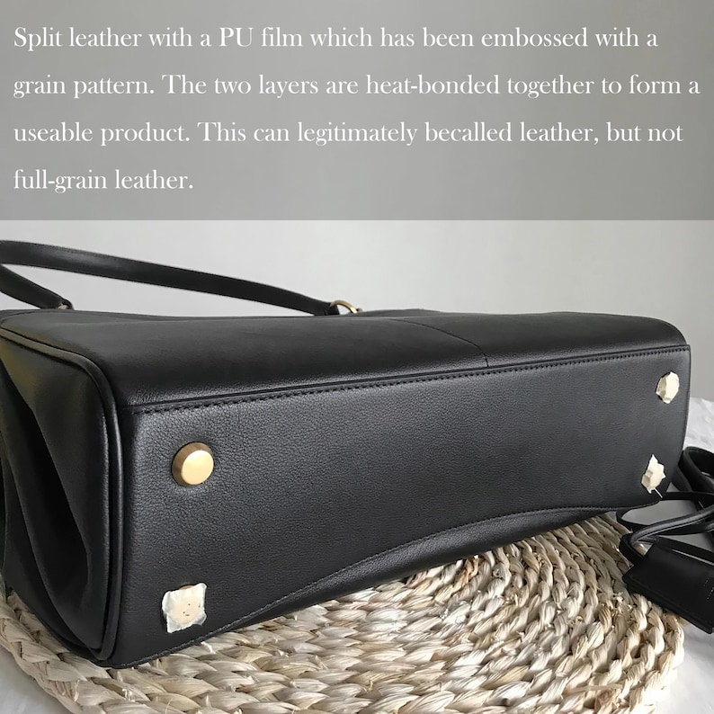 May include: A black leather handbag with gold-colored studs on the bottom. The bag has a top handle and a shoulder strap. The text in the image describes the material as split leather with a PU film.