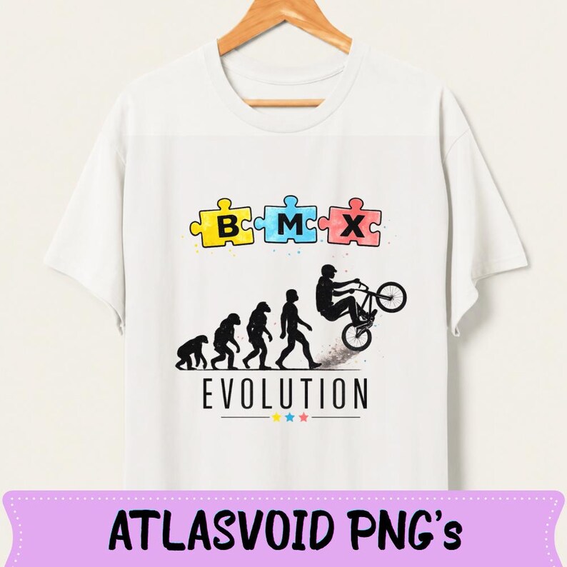May include: White t-shirt featuring a BMX-themed design. The graphic includes puzzle pieces spelling "BMX", an evolution of man illustration, and a BMX rider. The word "EVOLUTION" is printed below the illustration.