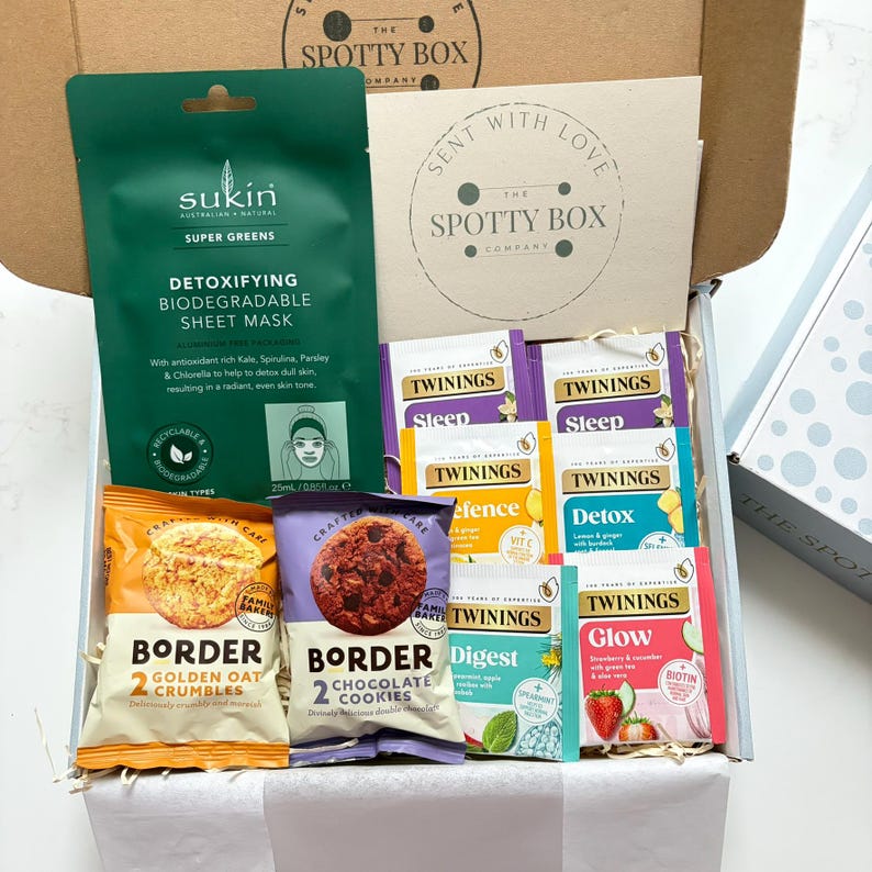 gift hamper containing 2 packs of border biscuits, 6 herbal/fruit tea bags and a sukin facemask. Nicely presented with a note card for a personalised message to be added