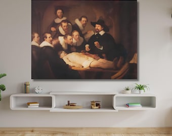 May include: A rectangular canvas print of Rembrandt's The Anatomy Lesson of Dr. Nicolaes Tulp, depicting a group of men in dark clothing with white collars observing a medical dissection of a pale body on a table in a dimly lit room.
