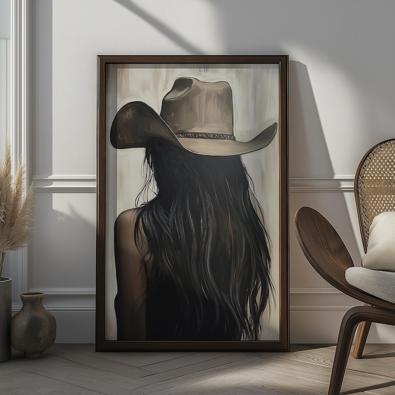 May include: A painting of a woman with long, dark hair wearing a brown cowboy hat. The woman is facing away from the viewer and her hair is flowing down her back.