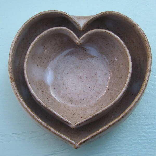 pair of miniature nesting hearts - a symbol of a mother's love