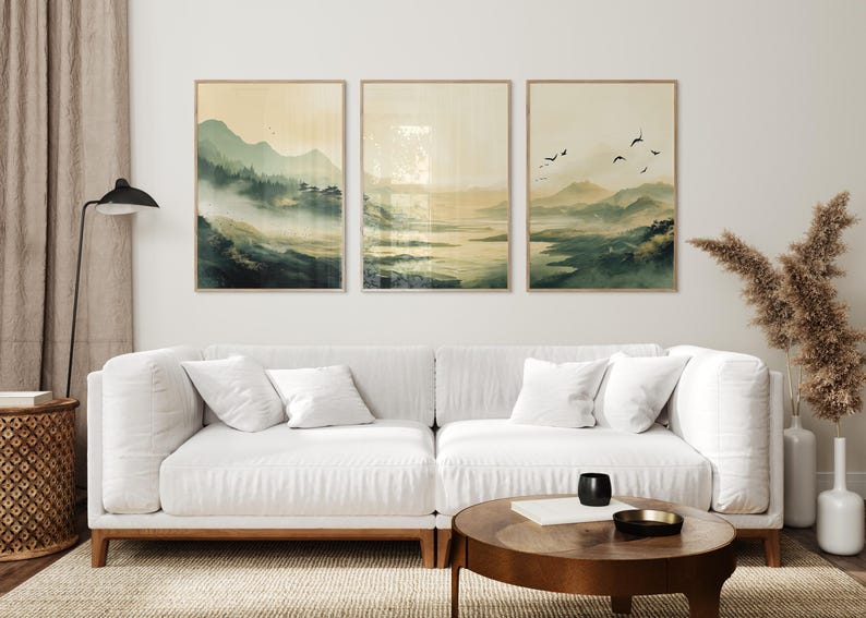 Japandi wall art featuring an olive-green, misty mountain landscape with a serene lake and a traditional Japanese town. This set of three is inspired by Japandi minimalism, this vertical wall art is ready to be printed in all common sizes.