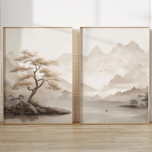 Puede incluir: Dos impresiones enmarcadas con un estilo minimalista y abstracto. La impresión de la izquierda presenta un árbol marrón en una pequeña isla en un lago con montañas en el fondo. La impresión de la derecha presenta una cordillera con un lago en primer plano.