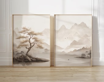May include: Two framed prints with a minimalist, abstract style. The left print features a brown tree on a small island in a lake with mountains in the background. The right print features a mountain range with a lake in the foreground.