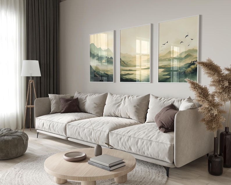 Japandi wall art featuring an olive-green, misty mountain landscape with a serene lake and a traditional Japanese town. This set of three is inspired by Japandi minimalism, this vertical wall art is ready to be printed in all common sizes.