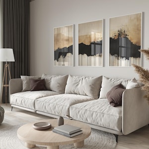 Minimalist abstract triptych featuring earthy beige and black tones with textured brushstrokes and dripping ink effect, evoking Japandi style.