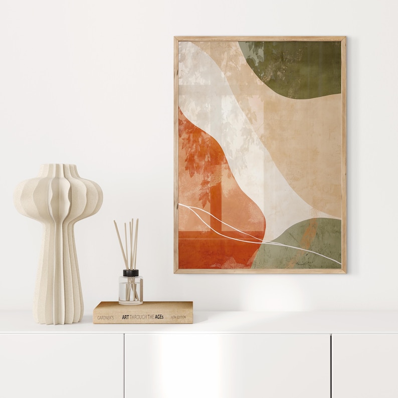 A refined piece of abstract Japandi wall art, showcasing calming organic shapes in shades of serene green, warm orange, and soft beige. This ready-to-print art piece comes in all common sizes, perfect for adding a touch of brightness to walls.