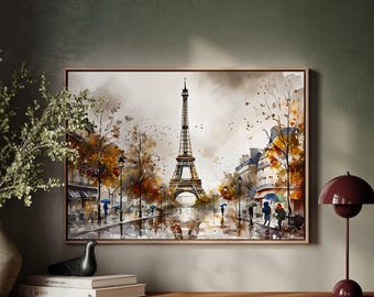 Könnte beinhalten: Aquarellmalerei des Eiffelturms in Paris, Frankreich, an einem regnerischen Tag. Das Kunstwerk zeigt eine gedämpfte Farbpalette mit Braun-, Grau- und Orangetönen. Menschen mit Regenschirmen gehen die Straße entlang. Das Gemälde ist gerahmt.