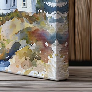 Watercolor canvas print of a lighthouse on a rocky cliff with seagulls flying in a pastel sunset sky.