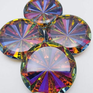 May include: Four iridescent, round decorative gems with a faceted design. The gems display a spectrum of colors, including purple, blue, yellow, and green, radiating from the center. The gems are arranged on a white background.