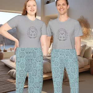 May include: Matching gray t-shirts and light blue pajama pants. The t-shirts feature a black hedgehog graphic. The pajama pants have a repeating pattern of hedgehogs and hearts. The pajamas are designed for comfort and relaxation.