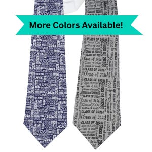 May include: Two neckties, one navy blue and one gray, are displayed. Both ties feature the text "2026" and "Class of 2026" in a repeating pattern. A teal banner above the ties reads "More Colors Available!"