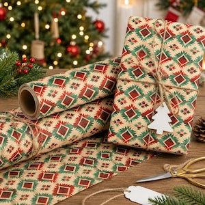 May include: Wrapping paper with a repeating geometric diamond pattern in red, green, and beige. A gift is wrapped in the same paper, tied with brown twine, and features a white wooden Christmas tree tag. Gold scissors lie on the surface.