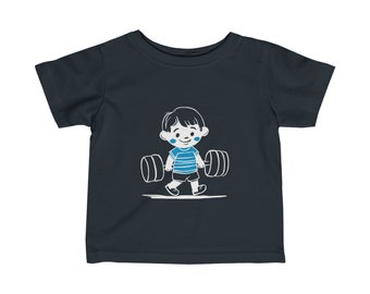 Ein süßes Kind, das Gewichte trägt. Feines Jersey-T-Shirt für Kleinkinder