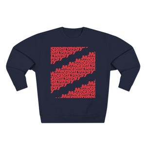 May include: Navy blue sweatshirt with a red graphic design featuring the words "Microstrategy" repeated in various sizes and orientations.
