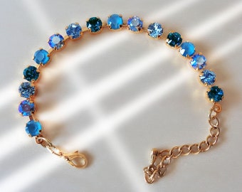 Swarovski crystal 6mm fancy stone tennis style bracelet  multi blue tones ,yellow gold plated