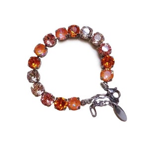 Swarovski crystal 8mm fancy stone tennis bracelet  orange and peach  tones ,rhodium silver plated