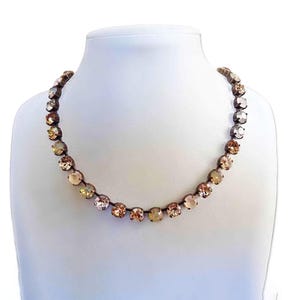 Tenniskette aus österreichischem Kristall in Gold- und Grautönen, antikes Messing