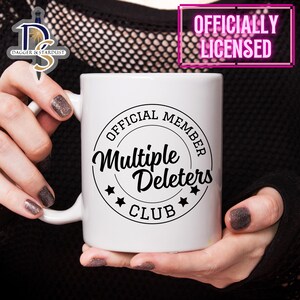 May include: White ceramic mug with a black circle design that says "Official Member Multiple Deleters Club".