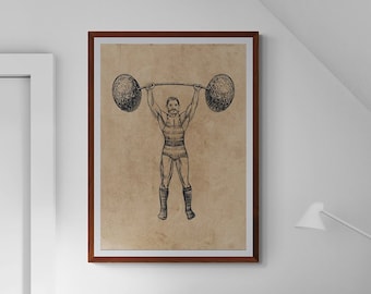 May include: A framed illustration of a strongman lifting weights, hanging above a wooden desk with a lamp and a stool. The desk has a light pink surface and the stool is made of natural wood.