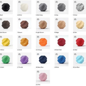 May include: A collection of twenty-one decorative, spherical objects in various colors, including black, white, gray, brown, yellow, orange, red, green, purple, blue, and pink. Each object has a spiral design and a smooth finish.