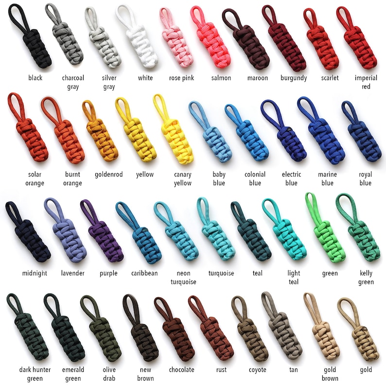 May include: A collection of 30 colorful zipper pulls made from paracord. The zipper pulls are arranged in rows and labeled with their color names. The colors include black, charcoal gray, silver gray, white, rose pink, salmon, maroon, burgundy, scarlet, imperial red, solar orange, burnt orange, goldenrod, yellow, canary yellow, baby blue, colonial blue, electric blue, marine blue, royal blue, midnight green, lavender, purple, caribbean, neon turquoise, turquoise, teal, light teal, green, kelly green, dark hunter green, emerald green, olive drab, new brown, chocolate, rust, coyote, tan, gold brown, and gold.