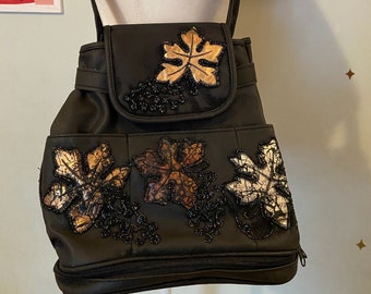 Vintage leather bag with beaded leaf appliqués