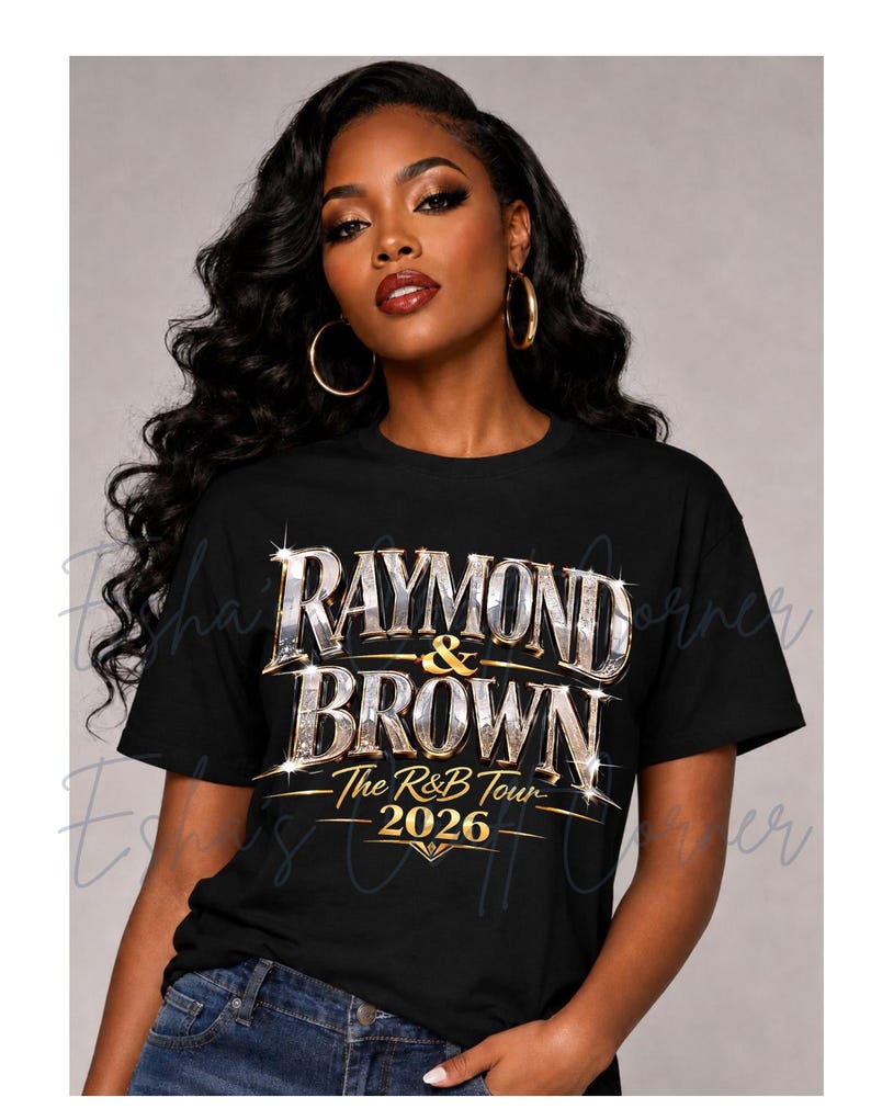 May include: Black t-shirt with the text "RAYMOND & BROWN - The R&B Tour - 2026" in a sparkling, metallic design. The shirt is worn by a person with long, dark hair and gold hoop earrings.
