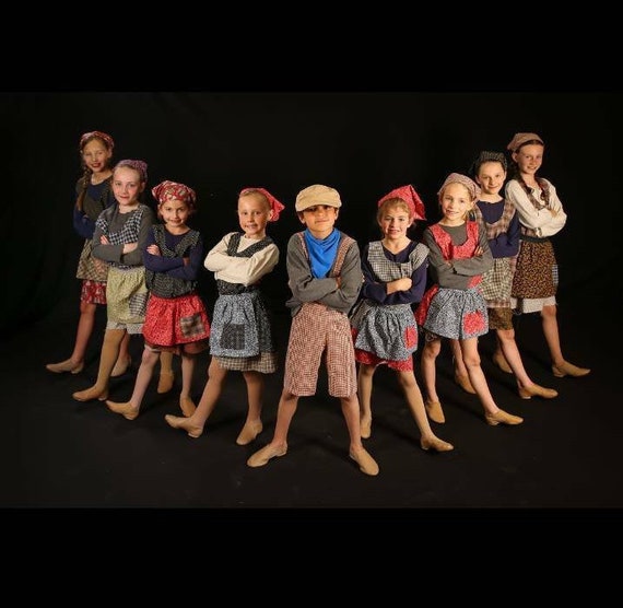 Private listing for group of 20 orphan costumes for Annie The Musical in viraety of colors and patterns