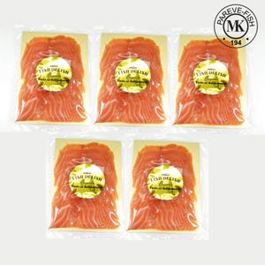 May include: Five packets of sliced salmon, each with a yellow label reading "FISH DELISH Canada Taste of Refinement." The salmon is a bright orange, and the packets are sealed in clear plastic.