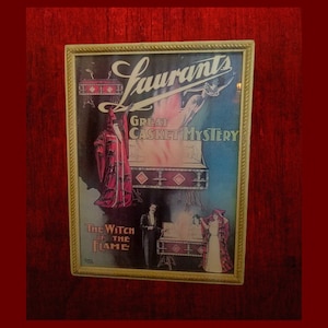 May include: A vintage poster advertising a magic show featuring a magician in a red robe and the text "Laurants Great Casket Mystery The Witch of the Flame".