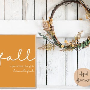 May include: A digital download of a printable wall art print with a mustard yellow background and white text that reads "fall is proof that change is beautiful".